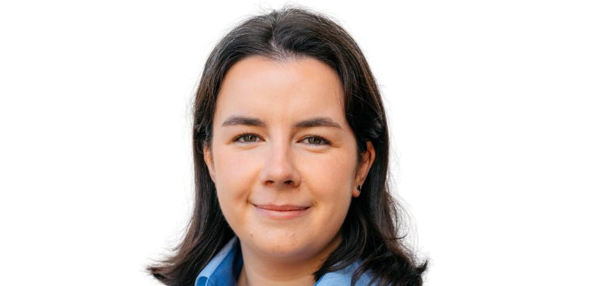 Girl with short, brown hair smiling