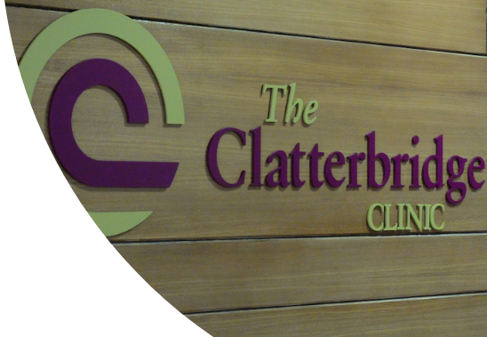 The Clatterbridge Clinic logo on a wooden wall.