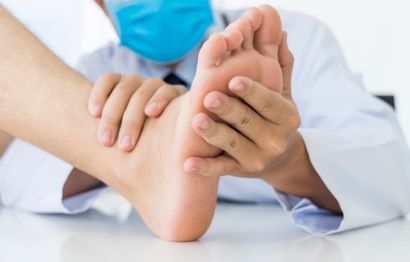 Doctor examining patient’s foot