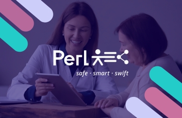 Doctor using a tablet to review medical information with a patient during a consultation.